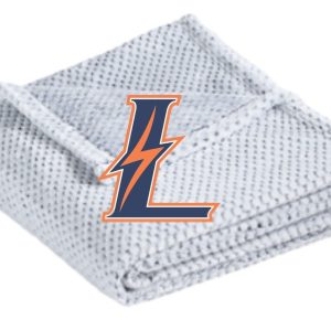 White blanket with an "L" logo.