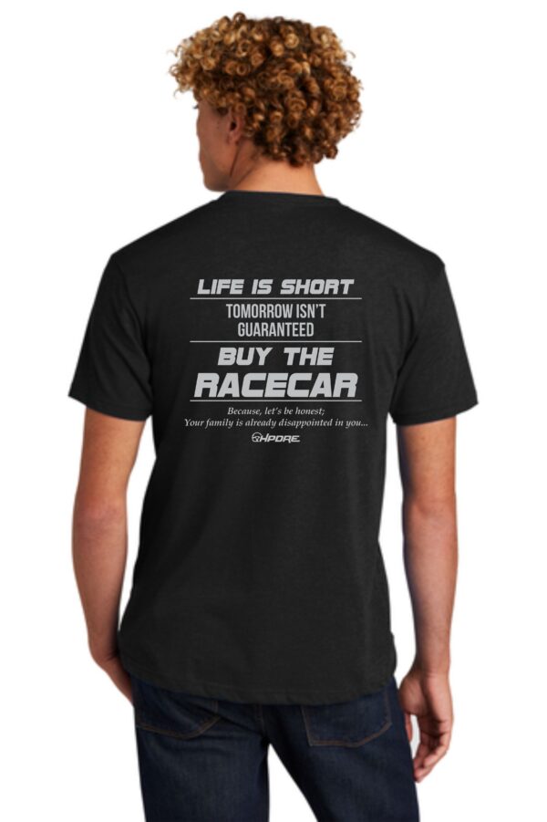 Man wearing a black t-shirt with a racing slogan.