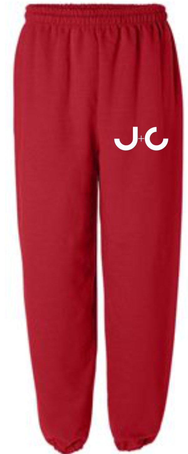 Red sweatpants with white J+C logo.