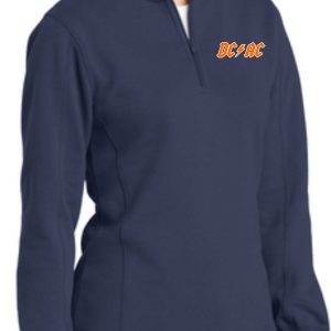 Woman in a navy blue Derby City AC DCAC logo Women 1/4 zip pullover with a quarter-zip neckline, featuring orange 'dcar' embroidery on the left chest.