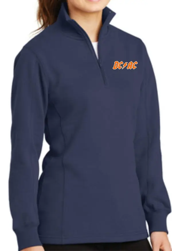 Woman in a navy blue Derby City AC DCAC logo Women 1/4 zip pullover with a quarter-zip neckline, featuring orange 'dcar' embroidery on the left chest.