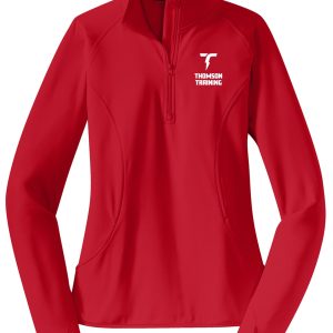 Thomson Training Ladies 1/2 zip pullover LST850 with a zippered front and the “thomson training” logo on the left chest, displayed on a plain background.