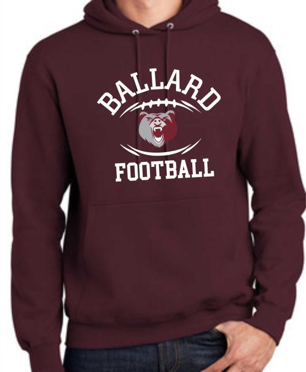 A person wearing a maroon Ballard Football Hoodie PC90H with the "ballard football" logo featuring a fierce bear design on the front.