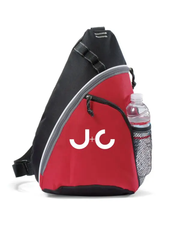 Red and black sling bag with "J+C" logo.