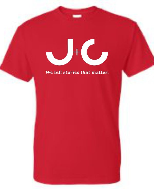 Red T-shirt with white J+C logo.