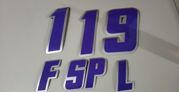 Purple and silver 119 FSPL stickers.