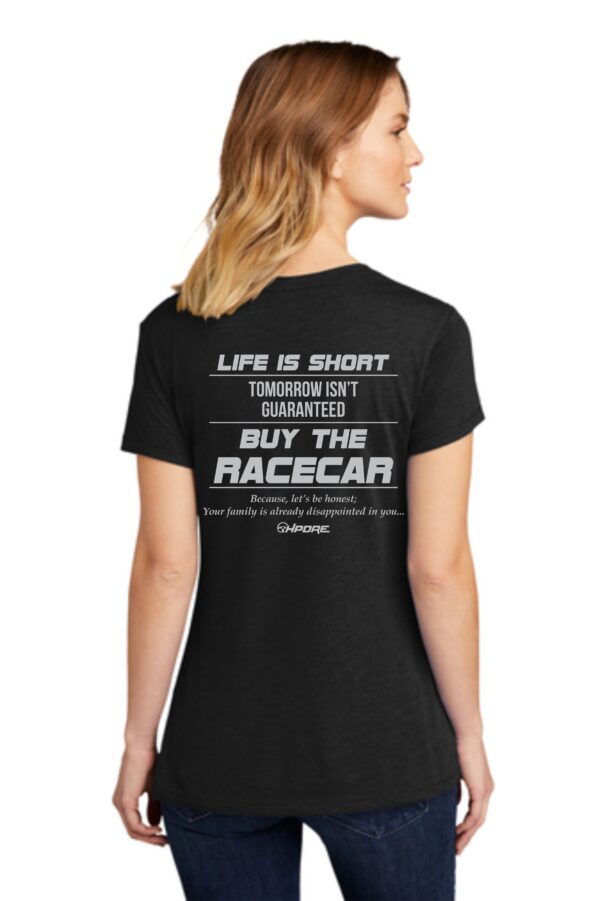 Woman in black shirt, "Buy the Racecar"